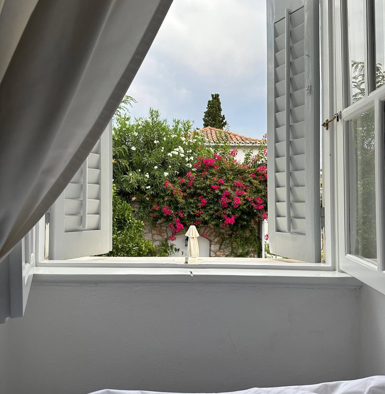 Morning light gently pours through… The quiet hum of the island, the scent of sea breeze and the timeless charm of Miranda hotel create a moment of pure serenity. 
Good morning! 

#morningcharm #windowview #hydra #mirandahotel